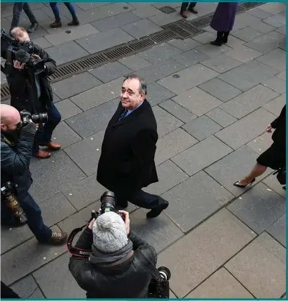 ??  ?? Alex Salmond gives his views outside court after the Scottish Government admitted acting unlawfully while investigat­ing sexual harassment claims against him. First Minister Nicola Sturgeon, pictured left, is under pressure over what she knew of the case and her contacts with Salmond on the matter