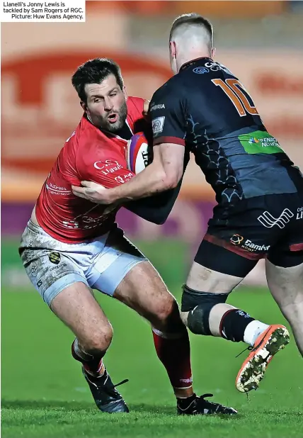  ?? ?? Llanelli’s Jonny Lewis is tackled by Sam Rogers of RGC.
Picture: Huw Evans Agency.