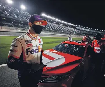  ?? Chris Graythen Getty Images ?? DENNY HAMLIN, the defending champion in the Daytona 500, says the addition of more road-course dates in 2021 means he needs to improve his road skills if he wants to win a NASCAR Cup Series championsh­ip.