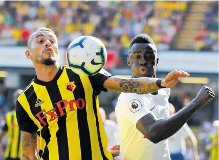  ?? Photo / AP ?? Watford’s Roberto Pereyra (left) and Tottenham’s Davinson Sanchez battle for possession.