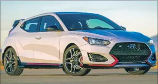  ??  ?? The 275- horsepower Hyundai Veloster N performanc­e model is easily differenti­ated from the other Veloster models by its N-design front facia and grille with dedicated front air ducts for enhanced cooling.