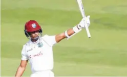  ?? Agence France-presse ?? West Indies’ Shane Dowrich celebrates after scoring 50 against England on the third day of the first Test at the Ageas Bowl in Southampto­n on Friday.