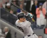  ?? THE CANADIAN PRESS PHOTO ?? New York Yankees’ Aaron Judge hits a two-run RBI single during ninth inning American League MLB baseball action against the Toronto Blue Jays in Toronto on Wednesday.