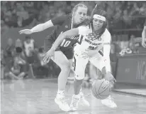  ?? ERIC GAY/AP ?? Louisville’s Hailey Van Lith fouls South Carolina’s Destanni Henderson during the second half of the semifinal round of the Women’s NCAA tournament on Friday in Minneapoli­s.