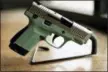  ?? THE ASSOCIATED PRESS ?? A 9mm handgun produced by Honor Defense, a gunmaker in Gainesvill­e, Ga., is displayed.