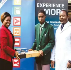  ??  ?? Audrey Mawoyo from MultiChoic­e Zimbabwe hands over prizes to Essay country winner Einstein Mubemi while his science teacher Mr Toro looks on