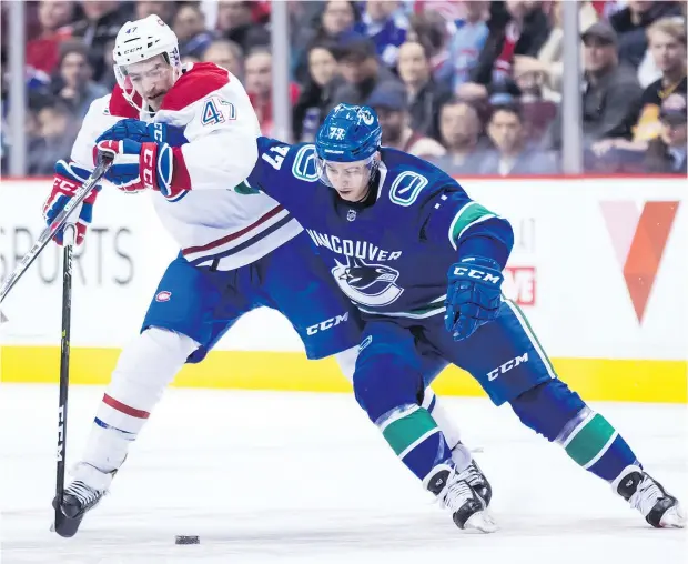  ?? — THE CANADIAN PRESS FILES ?? Canucks winger Nikolay Goldobin, here battling Montreal’s Kenny Agostino earlier this season, has had a streaky campaign, starting hot before going ice cold over a 13-game stretch and earning time in the press box.