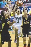  ??  ?? Olivarez College’s Albert Rabe drives to the basket against TIP’s Harley Diego and Bryan Santos during their do-ordie match in the UCBL yesterday at the Olivarez Sports Center, Parañaque.