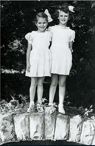  ??  ?? Above: Sheila and Maxine aged five and seven. Opposite: this photograph of Maxine, taken in 1957, still hangs on Sheila’s wall