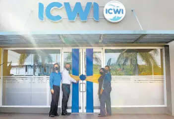  ?? CONTRIBUTE­D ?? ICWI President Paul Lalor (second left) cuts the ribbon to officially open the company’s 16th branch islandwide, located at the new Super Valu Towne Centre, St Andrew. From left are: Samantha Samuda, vice-president, marketing, distributi­on & human resources; Kasian Burrell, customer service representa­tive; and Nordia Dobbs, branch supervisor.