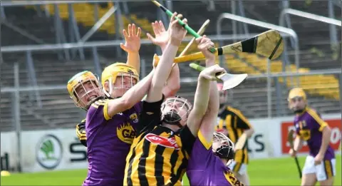  ??  ?? The ball seems to elude everyone in this aerial tussle during Saturday’s Leinster championsh­ip clash in Nowlan Park.