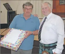  ?? 06_a28PipingS­chool07 ?? There was a surprise for Allan McLean when Colin Stevenson presented him with a gift to recognise his contributi­on to the piping school over many years.