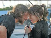  ??  ?? Bradley Cooper and Lady Gaga in ‘A Star is Born’. Top: A scene from ‘Roma’.