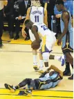  ?? Scott Strazzante / The Chronicle ?? Draymond Green steps over Mike Conley in the second quarter in Game 2. Conley was not pleased at the time.