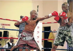  ?? / MARK ANDREWS ?? Simpiwe Konkco, left, going after Nkosinathi Joyi at the Orient Theatre in East London in this file picture.