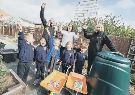  ?? ?? Pupils at Dame Dorothy Primary School celebrate receiving their new equipment.