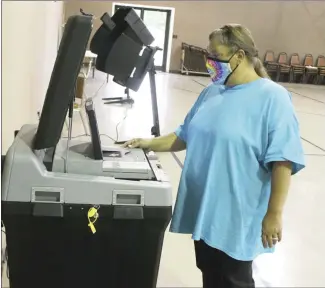  ?? Brodie Johnson • Times-Herald ?? Early voting in the Palestine-Wheatley School Board election opened this morning at the Cumberland Presbyteri­an Church in Palestine. Poll worker Tammy Thomas sets up a voting machine at the early voting site at the church site. Four seats on the district’s board are being contested. As of press time, 32 ballots had been cast in the election.