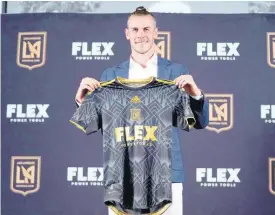  ?? AP ?? Gareth Bale poses for photos after being introduced as a new member of Major League Soccer’s Los Angeles FC in Los Angeles, California, yesterday.