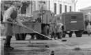  ?? Photograph: Everett Collection Inc/ Alamy ?? Cleaning the murdered strikers’ blood off the streets after the massacre in Dear Comrades!