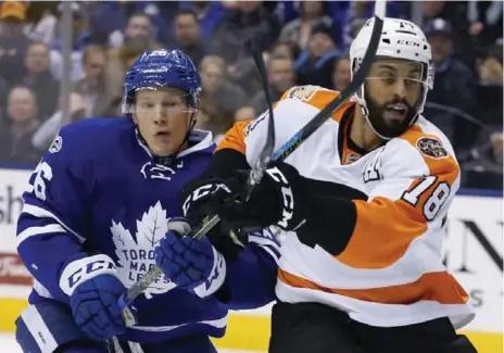  ?? RICK MADONIK/TORONTO STAR ?? Leafs winger Nikita Soshnikov and the Flyers’ Pierre-Edouard Bellemare keep tabs on each other. “There was not a lot of space,” said Mitch Marner.