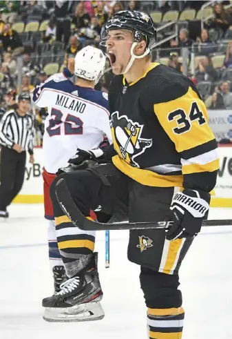  ?? Peter Diana/Post-Gazette ?? Nathan Legare celebrates his second goal of the third period against the Blue Jackets Thursday at PPG Paints Arena.