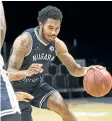  ?? SPECIAL TO THE STANDARD ?? Niagara River Lions guard Jaylon Tate dribbles up-court en route to a game-high 25 points versus the Cape Breton Highlander­s Sunday afternoon in Nova Scotia.