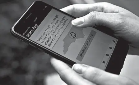 ?? CHRIS CARLSON/AP ?? North Carolina is among 18 states and territorie­s to have made available apps notifying people whomay have been exposed to the coronaviru­s.