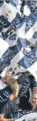  ?? Getty. ?? A club steward watches on as fans display finale flags at yesterday’s White Hart Lane farewell.