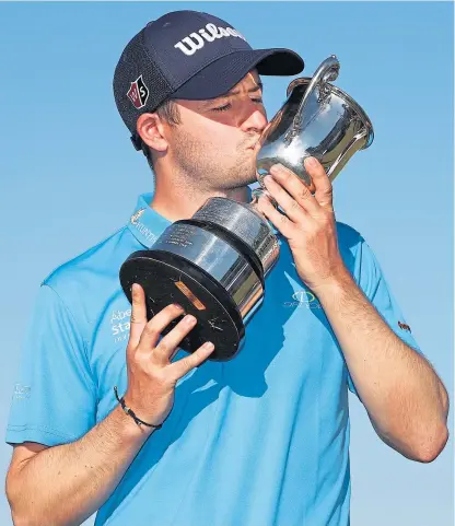  ?? Picture: Getty Images. ?? David Law kisses the trophy after his one shot victory in the ISPS Handa Vic Open.