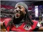  ??  ?? Cornerback Desmond Trufant celebrates a 34-23 victory over the Packers.