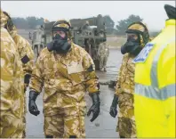  ?? AP PHOTO ?? Members of the Falcon Squadron, Royal Tank Regiment, at Winterbour­ne Gunner, southern England, conducting final preparatio­n and training before deploying in support of the civil authoritie­s in Salisbury city centre, Friday.