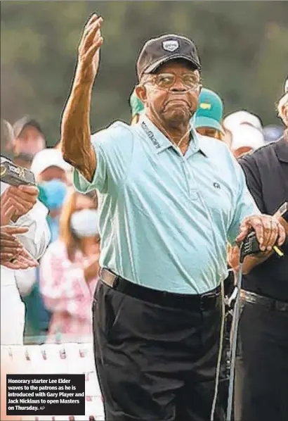  ?? AP ?? Honorary starter Lee Elder waves to the patrons as he is introduced with Gary Player and Jack Nicklaus to open Masters on Thursday.