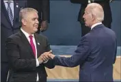  ?? Francine Orr Los Angeles Times ?? OUTGOING Colombian President Iván Duque with President Biden at the Los Angeles summit Friday.