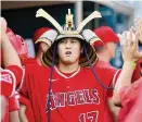  ?? Duane Burleson/TNS ?? Shohei Ohtani of the Los Angeles Angels celebrates with teammates after hitting a solo home run during the fourth inning in the second game of a doublehead­er at Comerica Park on July 27, in Detroit.