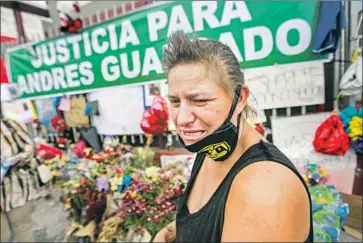  ?? Jason Armond Los Angeles Times ?? GEORGENA LAIRD grieves for Andres Guardado, who was fatally shot by a sheriff’s deputy June 18 in Gardena, near where she lives. Laird said she is still emotional from viewing the events around the killing.