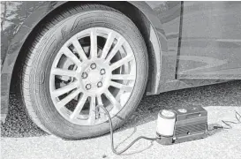  ?? General Motors via New York Times ?? This tire inflator was supplied with the 2011 Chevrolet Cruze Eco. Nearly a third of the 2017 model cars offered in the U.S. do not come outfitted with a spare tire as standard equipment, according to a study by AAA.