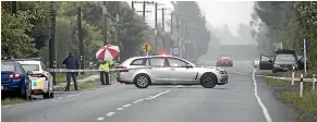  ?? GEORGE HEARD/STUFF ?? The scene in Bangor Rd, Darfield, on Sunday where a man died of a gunshot wound after hitting a police officer with a car.