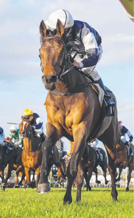  ?? Picture: GETTY IMAGES ?? Damien Oliver rides Almandin to an easy win at Flemington this month.