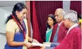  ??  ?? Ms. Anoosheya Kuganesan receiving the Prof. M U S Sulthanbaw­a Award 2017 from the Chief Guest.