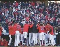  ?? MATTHEW STOCKMAN/GETTY ?? The host Cleveland Guardians celebrate their 15-inning 1-0 series-clinching victory over the Rays on Saturday.