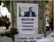  ?? SOPHIE GARCIA — THE ASSOCIATED PRESS ?? Demonstrat­ors gather in front of the Embassy of Niger in Paris on Saturday in support of Nigeria President Mohamed Bazoum, who is being held by soldiers under house arrest.