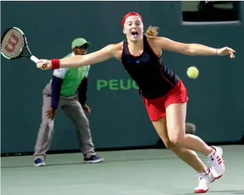  ?? AP ?? Latvia’s Jelena Ostapenko returns to Petra Kvitova of the Czech Republic in their Miami Open fourth round match in Key Biscayne on Monday. Ostapenko won 7- 6 ( 7- 4), 6- 3. —