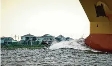  ?? Jon Shapley/Staff photograph­er ?? A ship passes through the area between Galveston Island and the Bolivar Peninsula in 2022. A new study is being conducted to see if a seawater desalinati­on plant might be feasible in Galveston.