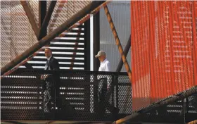  ?? Ross D. Franklin / Associated Press ?? Attorney General Jeff Sessions (right) visits the U.S.-Mexico border at Nogales, Ariz., where he announced tough measures to deal with illegal immigratio­n.