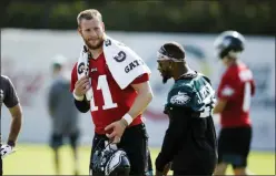  ?? MATT ROURKE ?? Philadelph­ia Eagles quarterbac­k Carson Wentz and wide receiver DeSean Jackson meet during practice at the NFL football team’s training camp in Philadelph­ia, Friday, July 26, 2019.