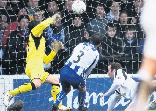  ??  ?? Head man Keenan dives in at the backpost to head Ayr level following Manuel Pascali’s early opener for Killie