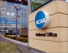  ?? AP Photo/Michael Conroy ?? The national office of the NCAA in Indianapol­is is shown on Thursday. The NCAA canceled the men’s and women’s Division I basketball tournament­s amid coronaviru­s fears on Thursday.