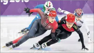  ?? THE CANADIAN PRESS/NATHAN DENETTE ?? Valerie Maltais, left, of Canada, competes as she tires to catch Chunyu Qu, right, of China, in the women’s 3,000m short track speed skating relay during the 2018 Olympic Winter Games in Gangneung, South Korea, Tuesday.