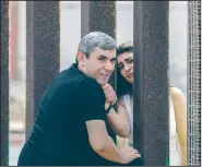  ?? Los Angeles Times/IRFAN KHAN ?? Arcen Avagyan sneaks into a prohibited area inside Mexico at the border fence at Imperial Beach, Calif., to share a moment with his wife, Anna Sargisyan, whom he had not seen in three years. He was quickly ordered back to restricted turf by a Border...