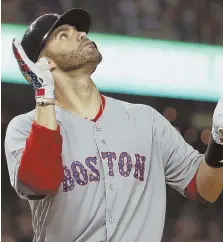  ?? AP PHOTO ?? NUMBER 26: J.D. Martinez celebrates his two-run home run in the ninth inning the Red Sox’ 11-4 rout of the Nationals last night in Washington.